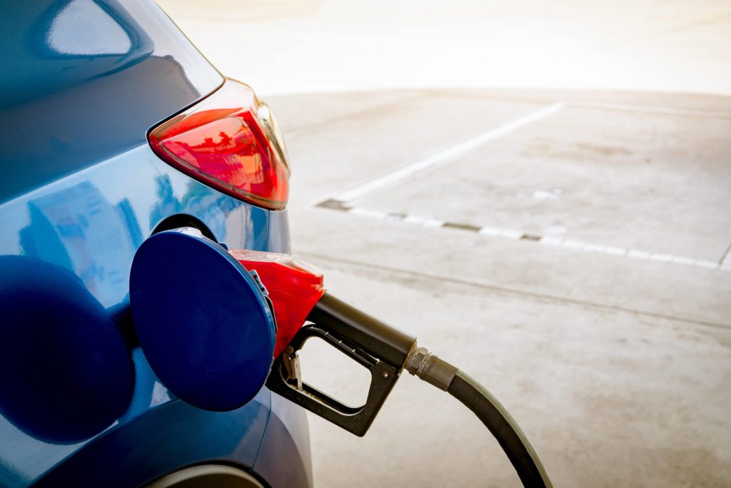 Blue-Car-Fueling-At-Gas-Station-Fuel-Economy-scaled