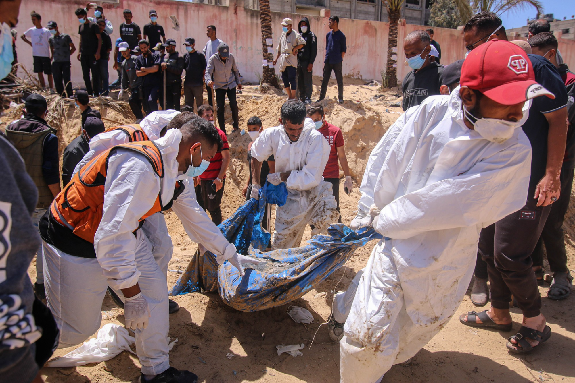 Nearly 300 bodies found in mass grave in Nasser hospital, says Gaza Civil Defense